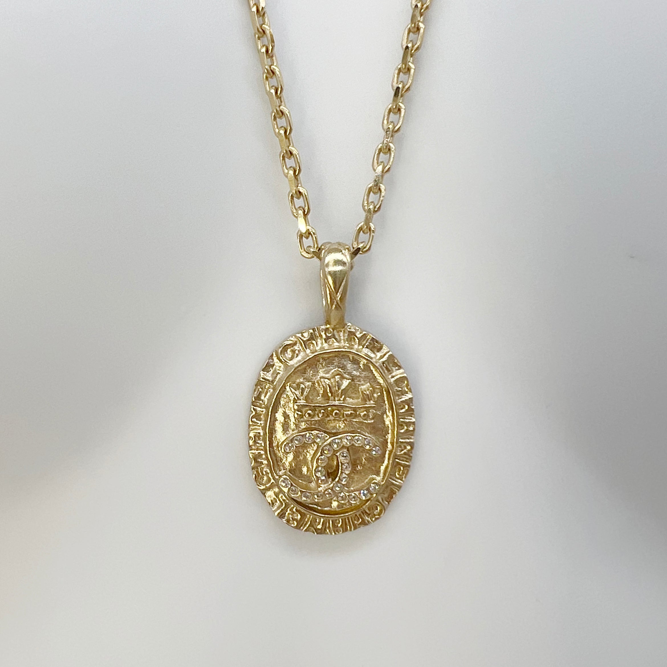 Guaranteed Authentic CHANEL Crystal CC Textured Crystal-Encrusted Medallion  Necklace Gold 16.25