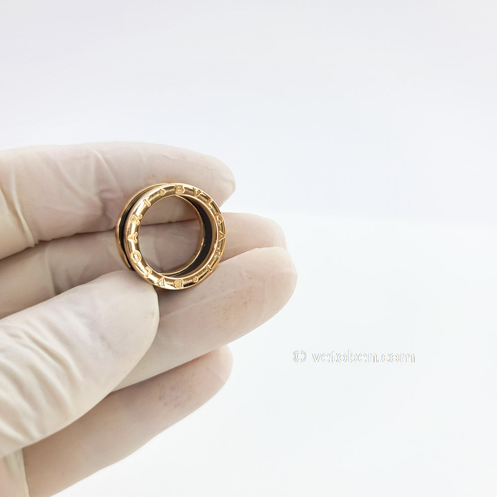 B.zero1 four-band ring with two 18 kt rose gold loops and a black ceramic spiral.
